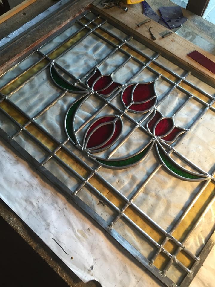 A photograph from the Legacy Stained Glass studio