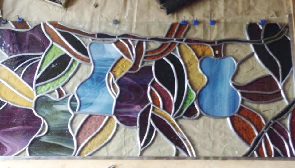 A photograph from the Legacy Stained Glass studio