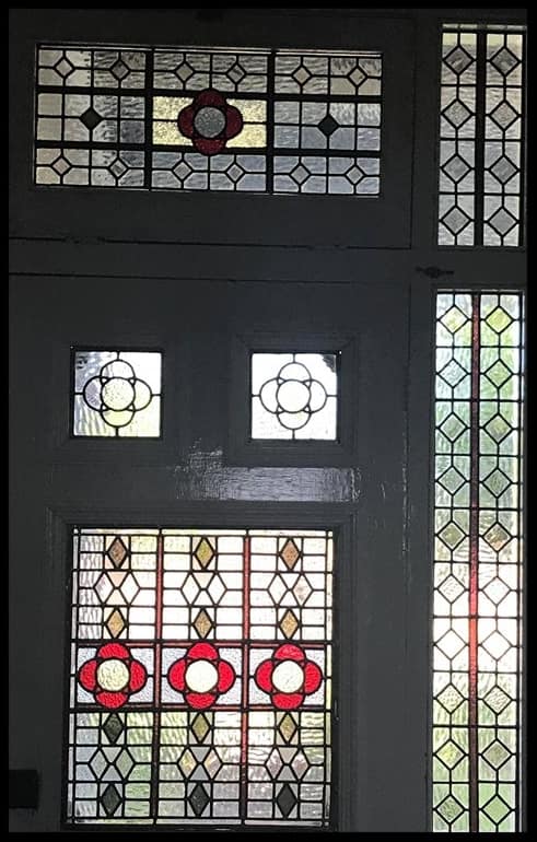 Full Victorian door, sidelights and transom in leadlight with red flower medallions