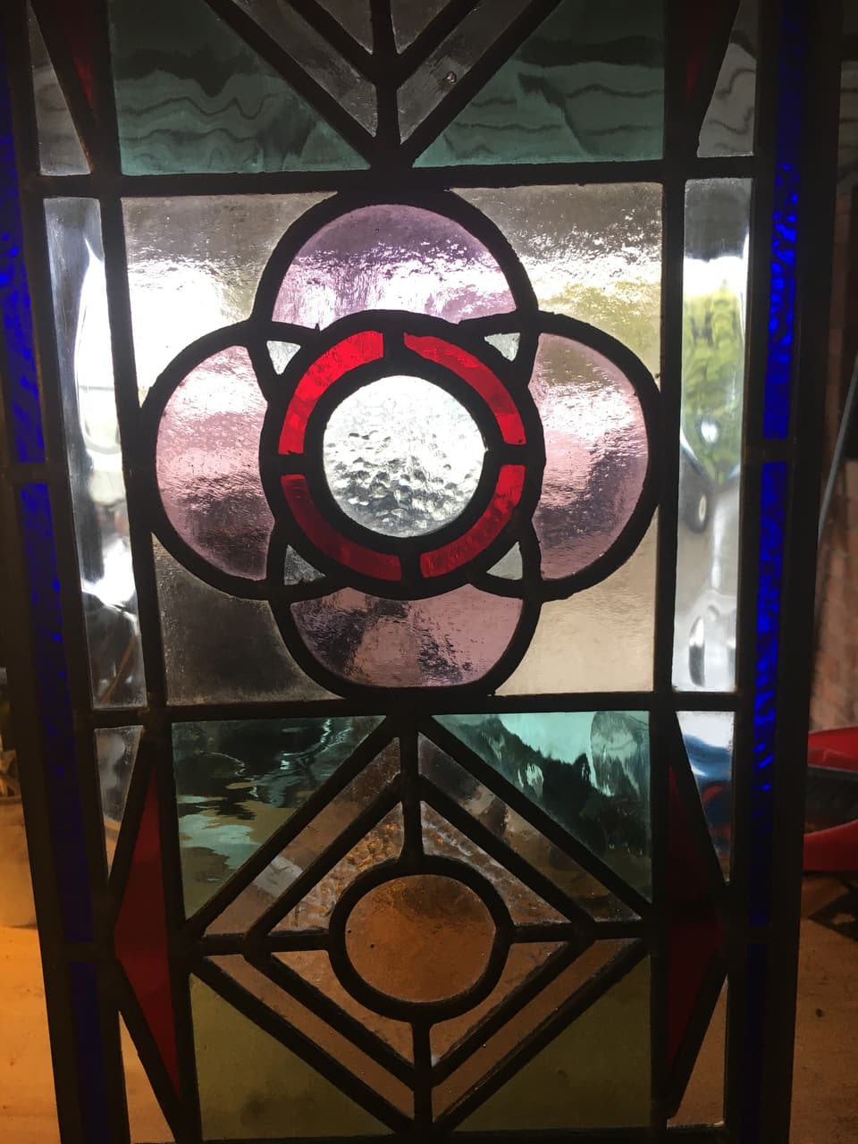Victorian flower medallion roundel in leadlight, red and clear glass