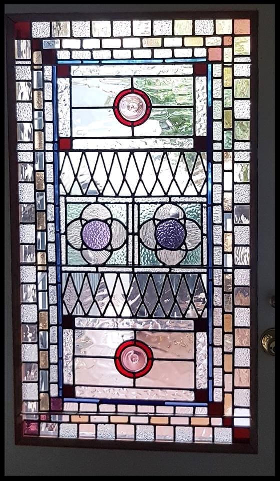 Victorian leadlight panel with a blue border, ruby roundels and faceted glass jewels
